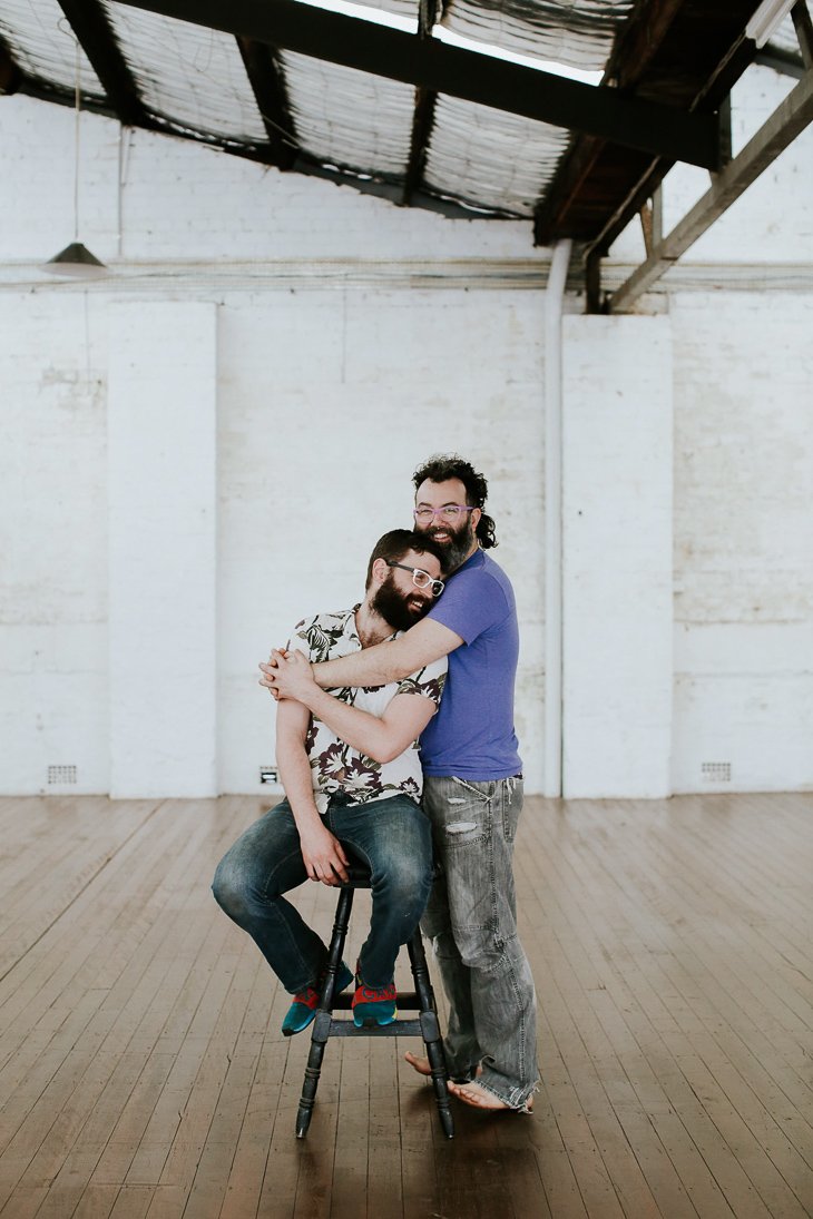 Brad + Scott. Together for 14 months, not legally allowed to marry in Australia. Cat whispering yogi mets chilli loving music nerd. “Hairy bearded queer soul mates”.