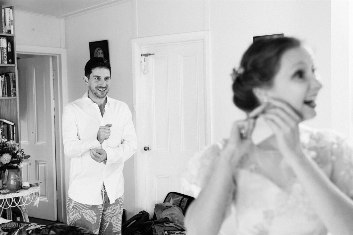 A bride and groom get ready together with their best friends